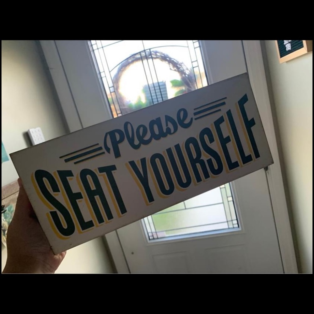 Please seat yourself sign
